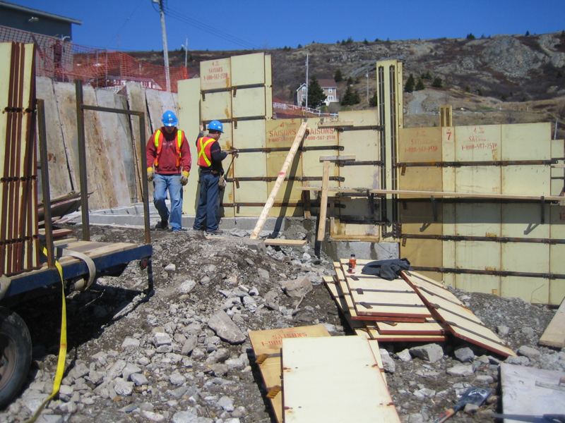Crew members assembling forms